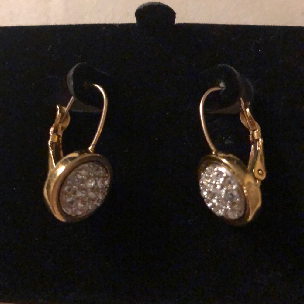 Earrings in one of them one stone is missing